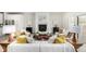 Bright living room with fireplace, wood accents, modern furniture and neutral tones at 3350 S Eudora St, Denver, CO 80222