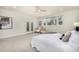 Large main bedroom with lots of natural light and seating area that leads to the exterior at 3350 S Eudora St, Denver, CO 80222