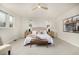 Bright main bedroom with neutral colors, ceiling fan, carpet, and modern furniture at 3350 S Eudora St, Denver, CO 80222