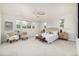 Light and airy main bedroom with lots of natural light, carpet, and modern furniture at 3350 S Eudora St, Denver, CO 80222