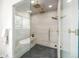 Large walk-in shower with dual shower heads and gold fixtures next to freestanding tub at 3350 S Eudora St, Denver, CO 80222