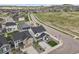 An aerial view of a neighborhood showing a lovely white house with a landscaped front yard at 5446 Coltin Trl, Castle Rock, CO 80104