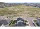Drone shot featuring house in suburban community surrounded by open space at 5446 Coltin Trl, Castle Rock, CO 80104
