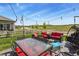 Outdoor patio with stylish furniture, string lights, and a lovely view of the neighborhood at 5446 Coltin Trl, Castle Rock, CO 80104