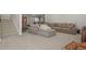 Spacious basement featuring a large sectional sofa, and a fitness area at 5446 Coltin Trl, Castle Rock, CO 80104