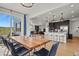 Open concept dining room shows sightlines to the gourmet kitchen and patio access at 5446 Coltin Trl, Castle Rock, CO 80104