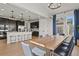 Dining room view with open floor plan, chef's kitchen and modern accents at 5446 Coltin Trl, Castle Rock, CO 80104