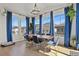 Elegant dining room with large windows, modern chandelier, and stylish table setting at 5446 Coltin Trl, Castle Rock, CO 80104