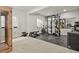 Bright exercise room with weightlifting rack and free weights, treadmill, and other fitness machines at 5446 Coltin Trl, Castle Rock, CO 80104
