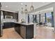 View of gourmet kitchen featuring a center island, white countertops, and modern appliances at 5446 Coltin Trl, Castle Rock, CO 80104