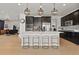 Kitchen with a center island, pendant lighting, and stainless steel appliances at 5446 Coltin Trl, Castle Rock, CO 80104