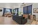 Inviting living room with hardwood floors, a modern fireplace, and stylish decor at 5446 Coltin Trl, Castle Rock, CO 80104