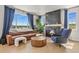 Spacious living room with a modern fireplace, comfortable seating, and large windows at 5446 Coltin Trl, Castle Rock, CO 80104