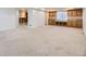 Finished basement with carpet flooring, built-in cabinets, and a sink area at 9617 Bighorn Way, Littleton, CO 80125