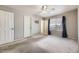 Spacious bedroom featuring neutral walls, a ceiling fan, and natural light from a window at 9617 Bighorn Way, Littleton, CO 80125