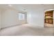 Bright bedroom with neutral carpet, white walls, and natural light from the window at 9617 Bighorn Way, Littleton, CO 80125