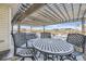 Outdoor covered patio with patio furniture, hot tub, and scenic views at 9617 Bighorn Way, Littleton, CO 80125