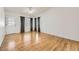 An airy living room featuring hardwood floors, a ceiling fan, and a backyard entrance at 9617 Bighorn Way, Littleton, CO 80125