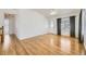 Bright living room featuring hardwood floors, a ceiling fan, and access to the backyard at 9617 Bighorn Way, Littleton, CO 80125