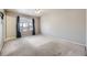 Carpeted main bedroom with large windows providing natural light at 9617 Bighorn Way, Littleton, CO 80125