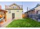 View of the backyard featuring a pergola, and a spacious grassy area at 4415 N Clay St, Denver, CO 80211