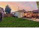 Backyard view showcasing a detached garage and pergola at 4415 N Clay St, Denver, CO 80211