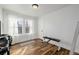 Bright bedroom with hardwood floors and large windows at 4415 N Clay St, Denver, CO 80211