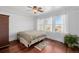 Spacious bedroom with hardwood floors, large windows, and ceiling fan at 4415 N Clay St, Denver, CO 80211