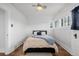 Bright bedroom with hardwood floors and a full-size bed at 4415 N Clay St, Denver, CO 80211