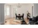 Sunlit dining room with hardwood floors and a charming wooden table at 4415 N Clay St, Denver, CO 80211