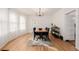 Sunlit dining room with hardwood floors and a charming wooden table at 4415 N Clay St, Denver, CO 80211