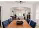 Open concept dining room with hardwood floors, and a view to the living room at 4415 N Clay St, Denver, CO 80211