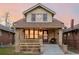 Attractive craftsman home, featuring a covered porch and landscaped yard at 4415 N Clay St, Denver, CO 80211