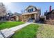 Classic home with a quaint front porch and walkway leading to the entrance at 4415 N Clay St, Denver, CO 80211