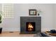 Modern fireplace with dark gray tile surround and a warm, inviting fire at 4415 N Clay St, Denver, CO 80211