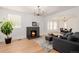 Bright and airy living room with a fireplace and ample natural light at 4415 N Clay St, Denver, CO 80211