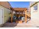 Outdoor living space featuring a pergola with comfortable seating and brick patio at 4415 N Clay St, Denver, CO 80211