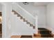 Elegant staircase with white railings and hardwood steps at 4415 N Clay St, Denver, CO 80211