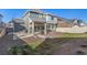 A spacious backyard with a covered patio, hammock, and plenty of room for outdoor activities at 4104 N Picadilly Ct, Aurora, CO 80019