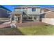 Large fenced backyard showcasing a covered patio and lush lawn at 4104 N Picadilly Ct, Aurora, CO 80019