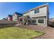 A spacious backyard with a covered patio, hammock, and great landscaping at 4104 N Picadilly Ct, Aurora, CO 80019
