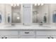 Bright bathroom featuring double sinks, contemporary fixtures, and lots of storage at 4104 N Picadilly Ct, Aurora, CO 80019