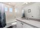 Bathroom featuring a shower-tub combo, neutral tile, and modern vanity at 4104 N Picadilly Ct, Aurora, CO 80019