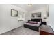 Bedroom with a queen-sized bed, modern art and a sleek, minimalist design at 4104 N Picadilly Ct, Aurora, CO 80019