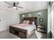 Nicely appointed bedroom featuring a ceiling fan and comfortable king-sized bed at 4104 N Picadilly Ct, Aurora, CO 80019