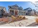 Attractive two-story home with inviting front porch, two car garage, and landscaped front yard at 4104 N Picadilly Ct, Aurora, CO 80019