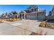 Stunning two-story home with a large driveway, stone accents, and modern design elements at 4104 N Picadilly Ct, Aurora, CO 80019