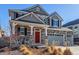 Charming two-story house with inviting front porch, two car garage and landscaped front yard at 4104 N Picadilly Ct, Aurora, CO 80019