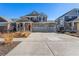 Beautiful two-story house with a spacious driveway and well-manicured front yard at 4104 N Picadilly Ct, Aurora, CO 80019