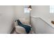Cozy loft space featuring a comfortable round chair, blanket, and reading lamp at 4104 N Picadilly Ct, Aurora, CO 80019